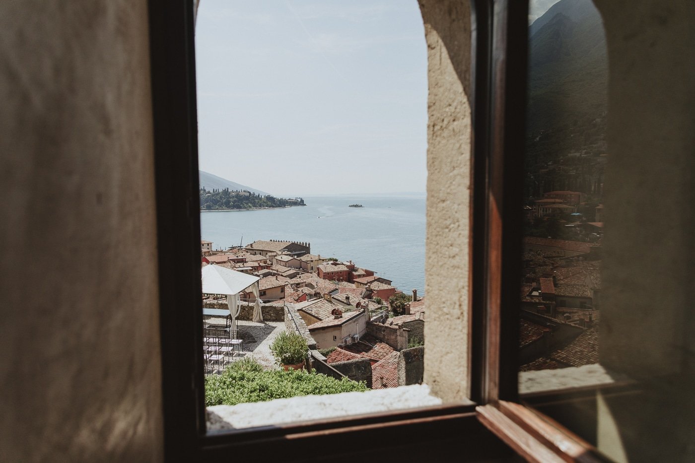 Looking out the window at lake garda in italy
