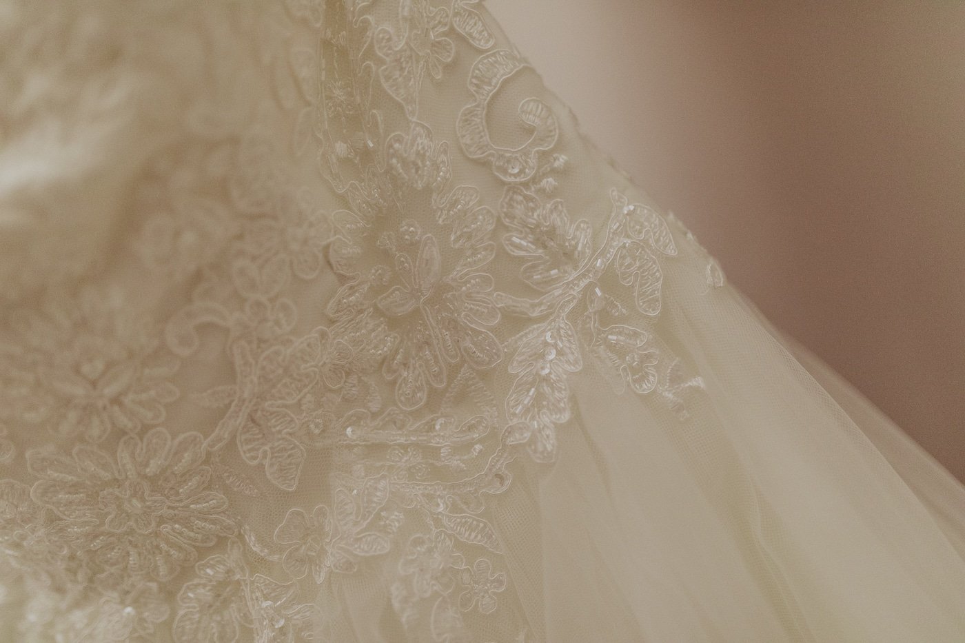 Close up of wedding dress with detailing and tulle
