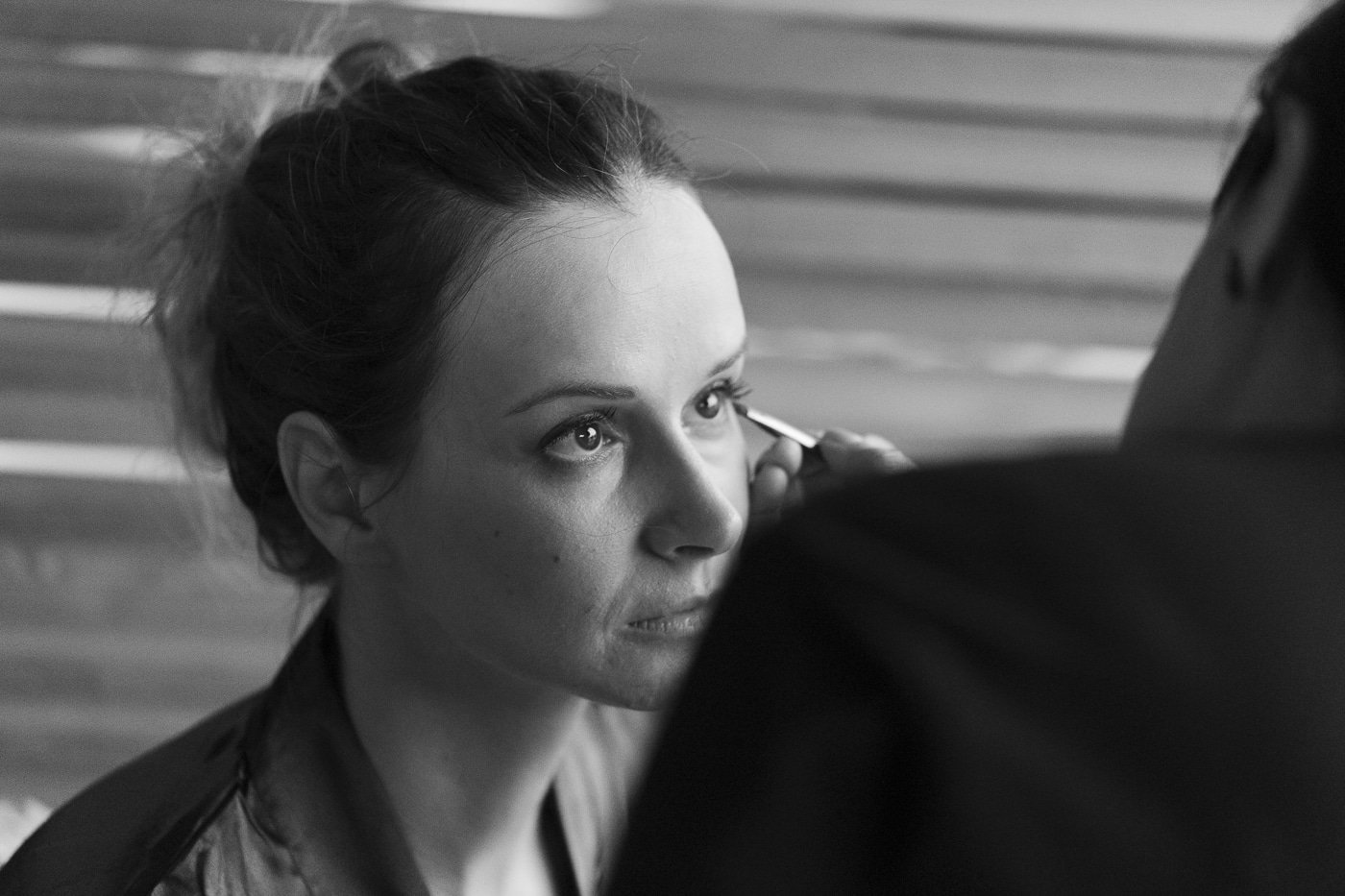 Bridesmaid having makeup done