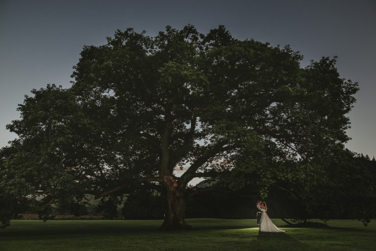 Creative photograph of backlit bride and groom at a Inn On The Lake Wedding by In On The Lake Wedding Photographer Joshua Wyborn