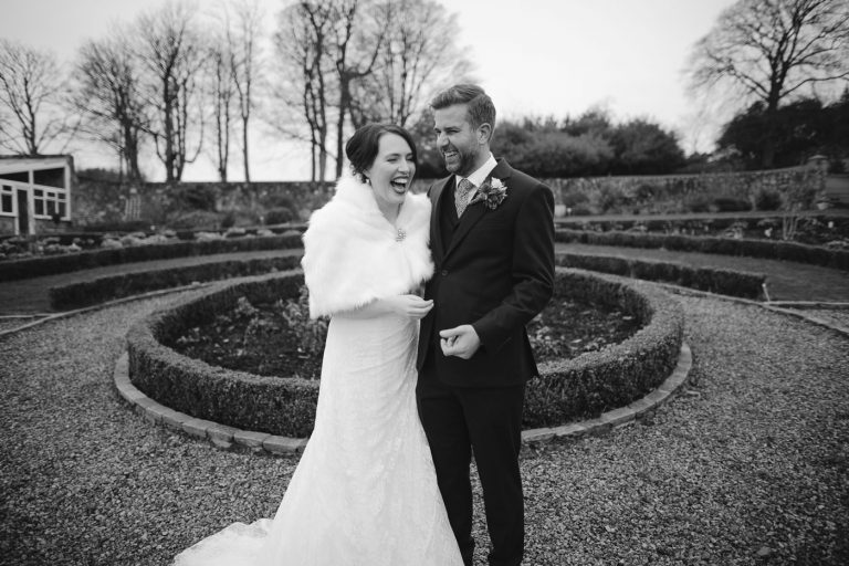 A black and white photo of a bride and groom at Balmule House.