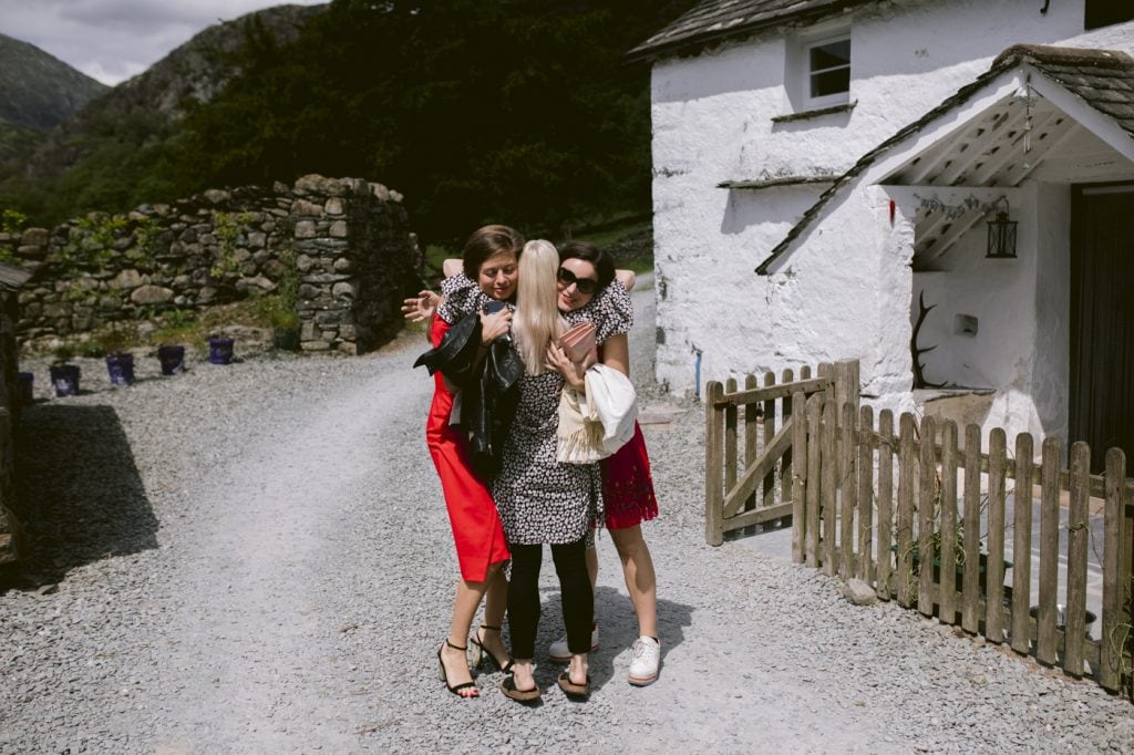 Greeting Guests with Hugs at Yew Tree Farm Wedding