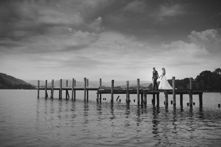Bride and Groom Walking Down the Jetty at Storrs Hall Wedding