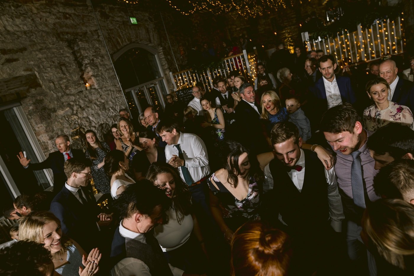 A group of people dancing at Askham Hall wedding reception.