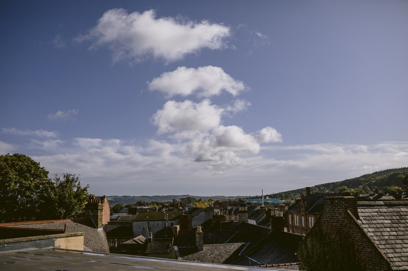 A breathtaking view from the roof of Hexham House with clouds in the sky.