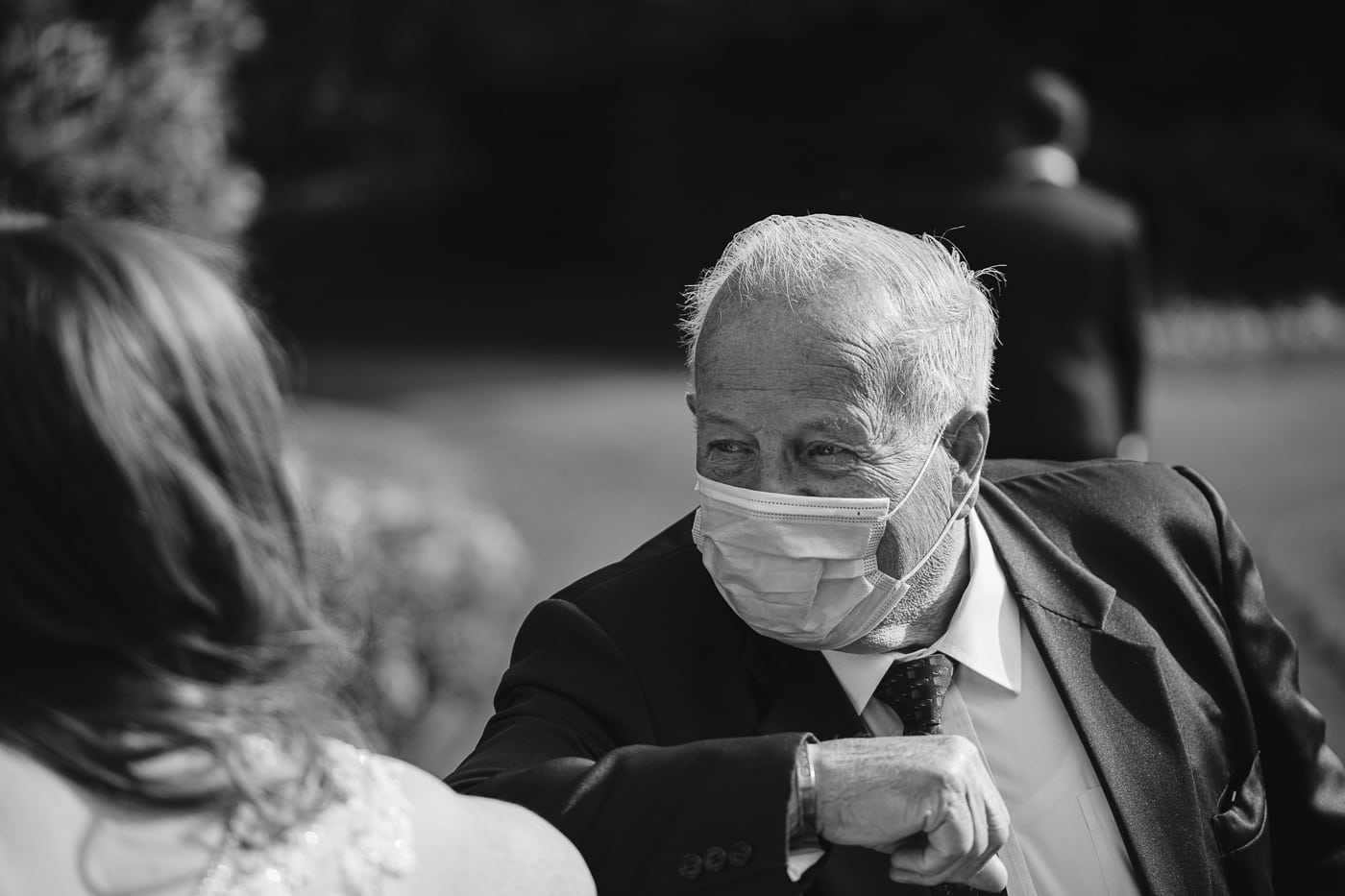 At Hexham House Wedding, a man in a suit is wearing a face mask.