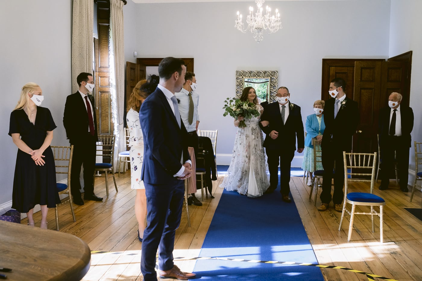 A Hexham House wedding, with the bride and groom walking down the aisle.