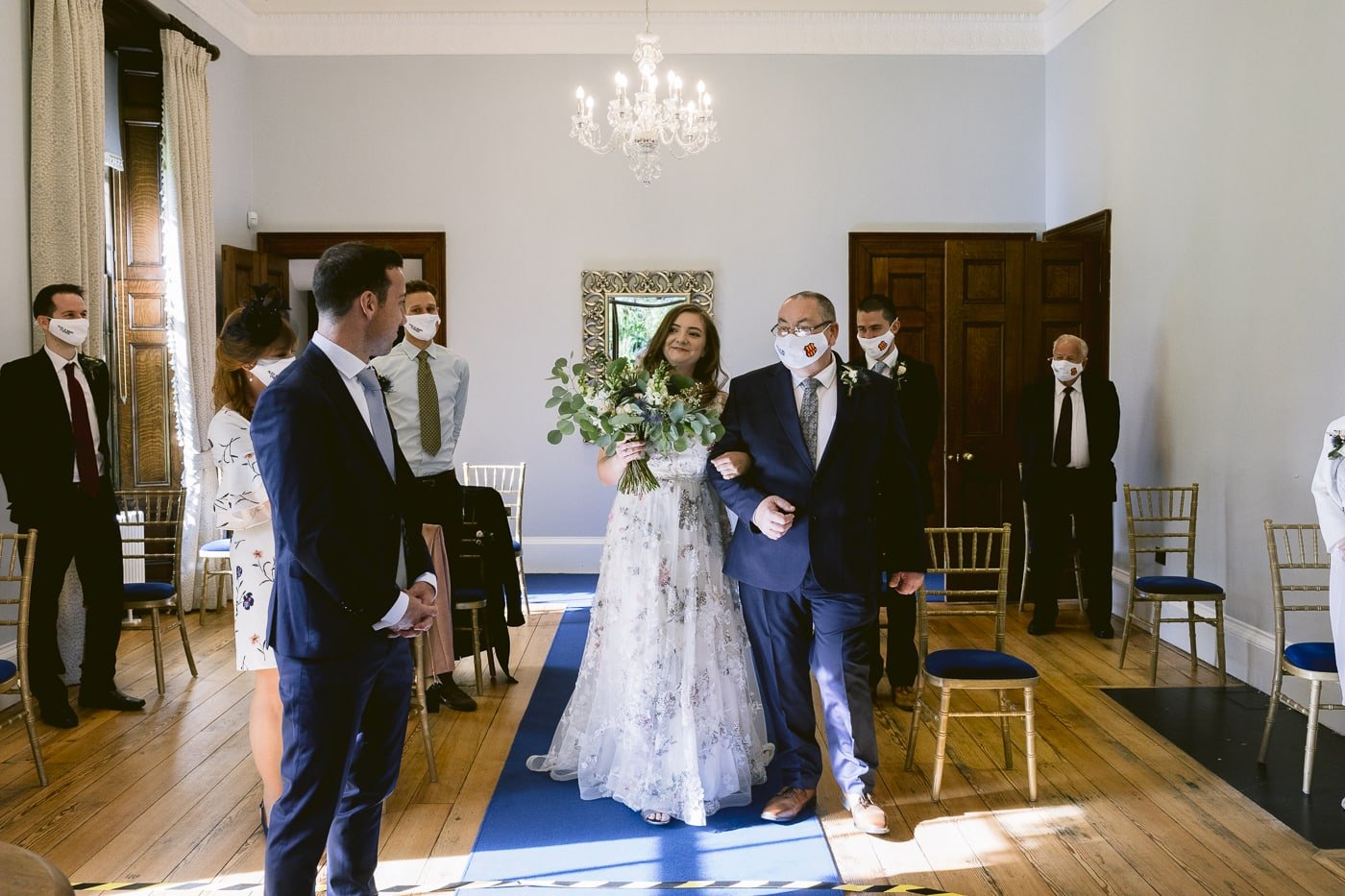 A Hexham House wedding, with the bride and groom walking down the aisle.
