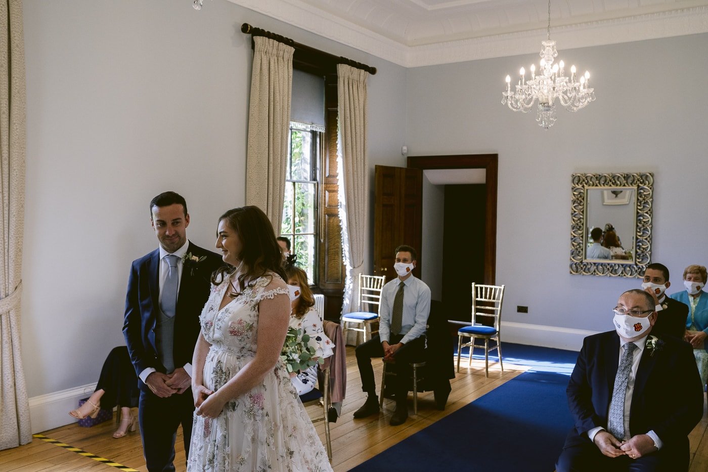 A bride and groom walking down the aisle at a Hexham House wedding.