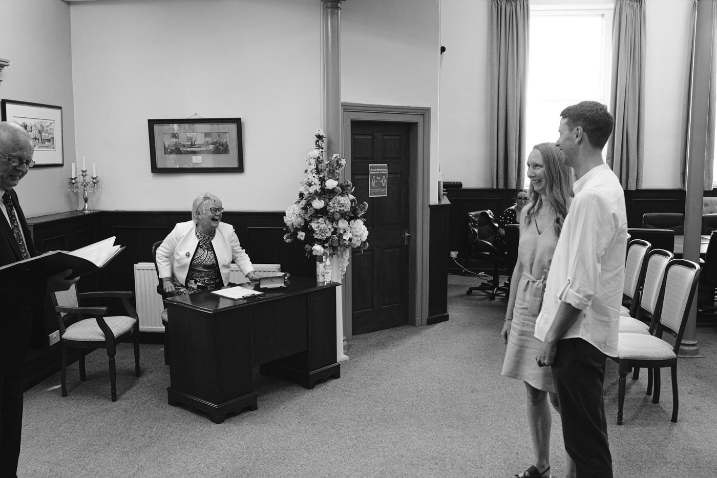 A man and woman are having a Civil Partnership in a courtroom at the Lake District.