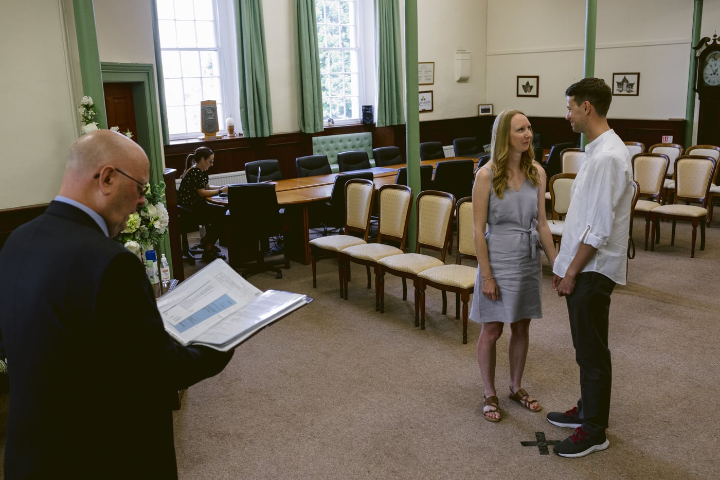 A man and woman are getting married in the Lake District.