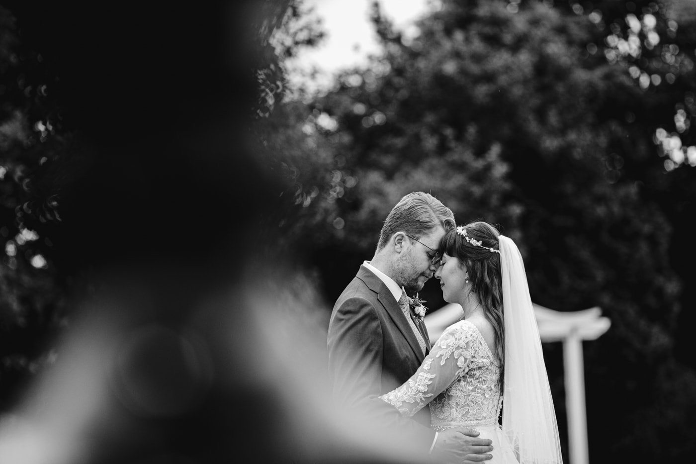An old black and white photo of a bride and groom at their wedding in Cartmel.