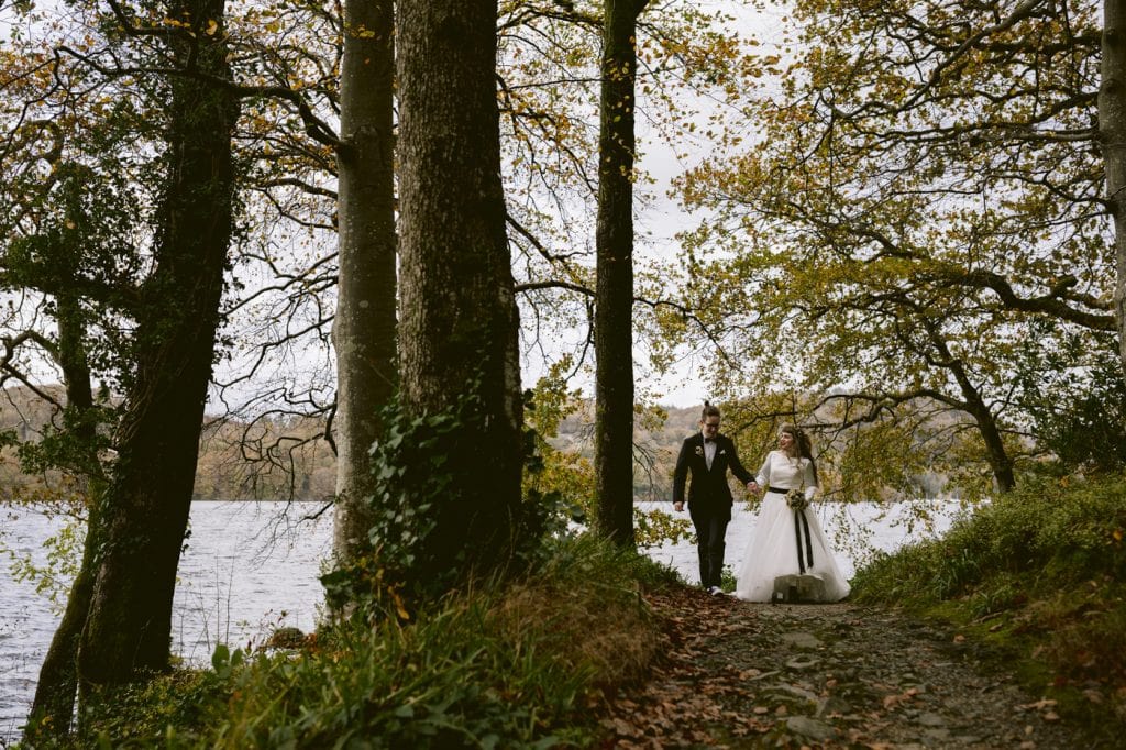 Bride and groom walking though Storrs Hall grounds on their elopement