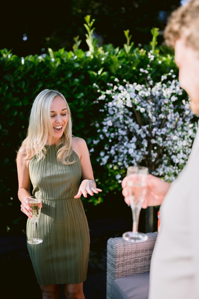 A man and woman are having a conversation in a garden.
