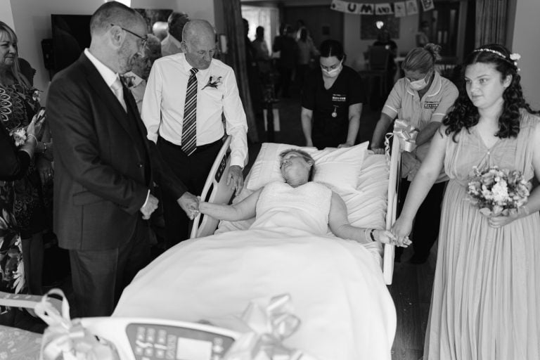 Eden Valley Hospice Wedding - A poignant black and white photo captures a bride in a hospital bed.