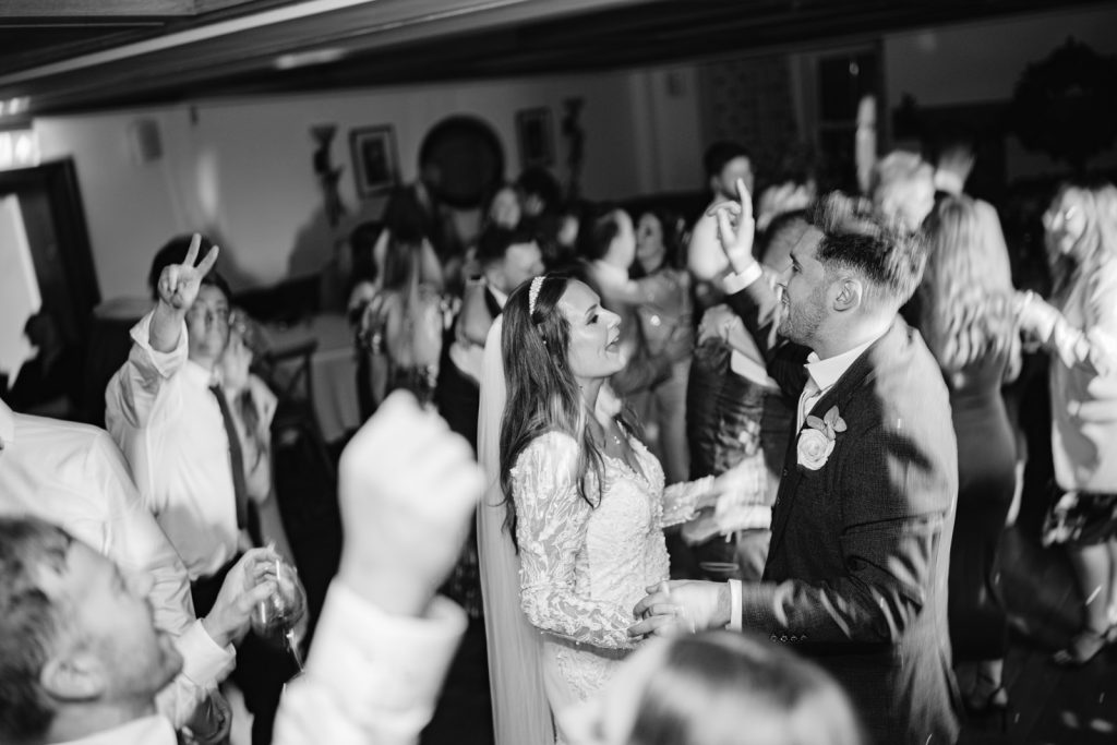 A bride and groom gracefully dancing on the winter wedding dance floor at Ruleholme.