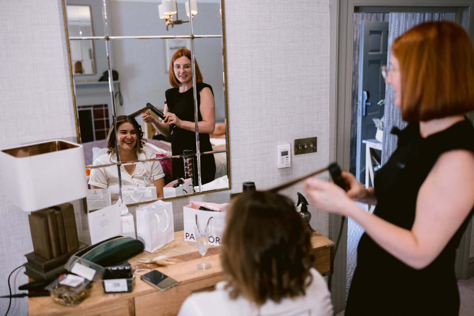 A woman getting her hair done at Gretna Hall Wedding venue.