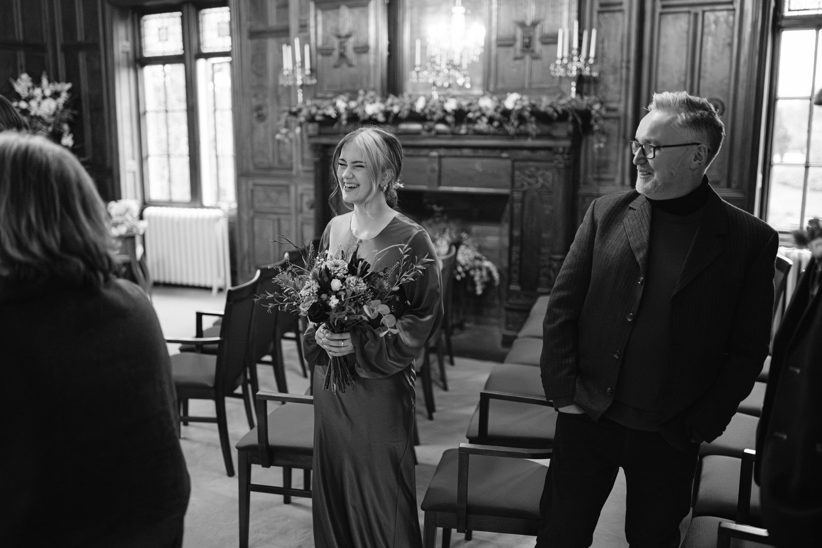 A bride and groom looking at each other in Lady Gillford's house.