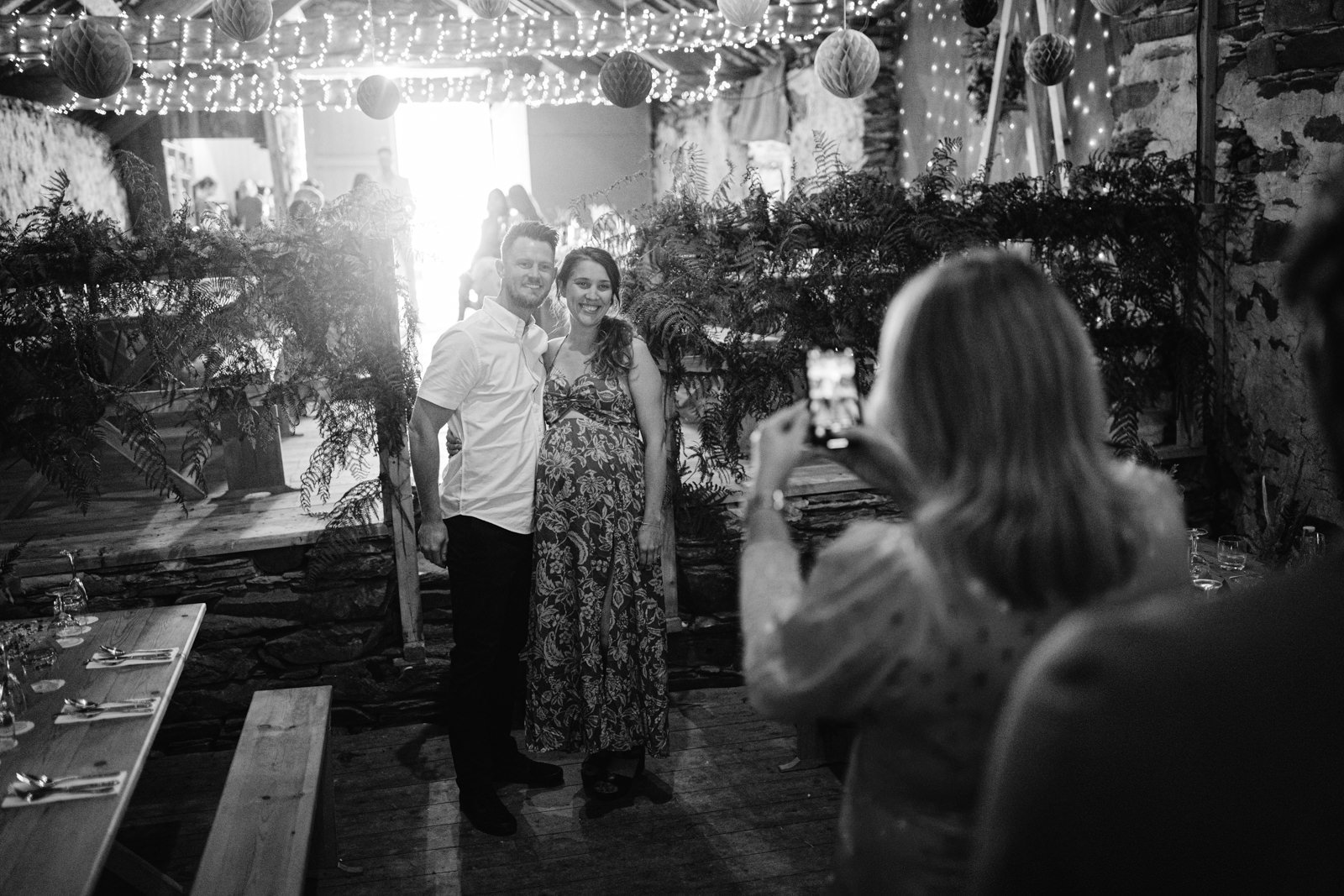 A man and woman posing for a picture at their summer wedding.