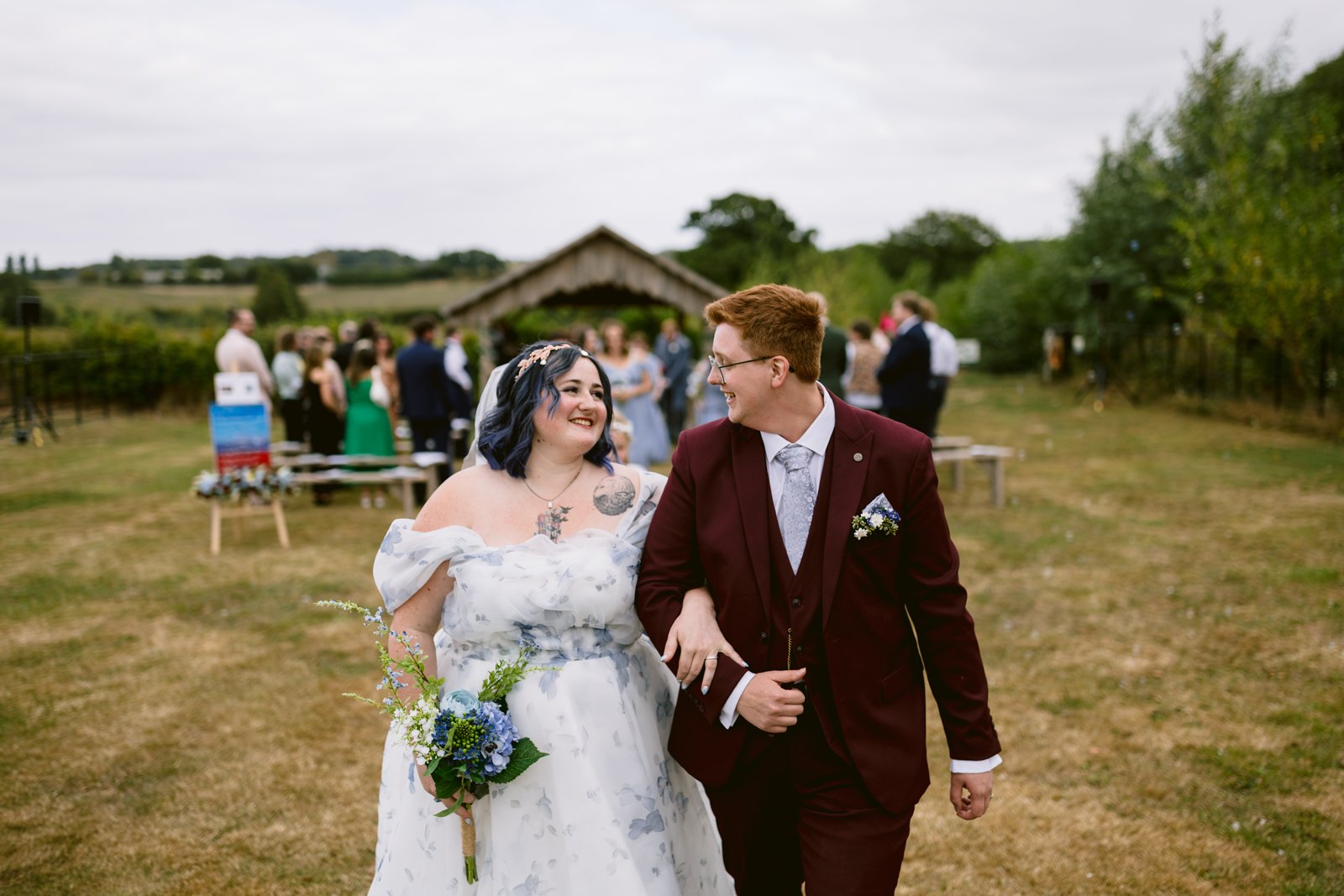 A man and woman in a wedding dress celebrate their special day at a rustic Stanford Farm wedding near Shrewsbury.